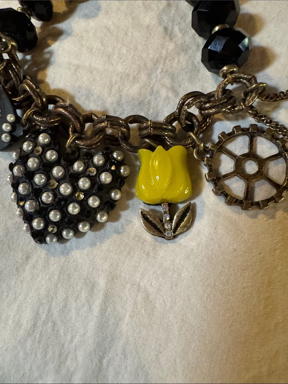 This piece is a RARE vintage Betsey Johnson Y2K COMPLETE Charm Bracelet.